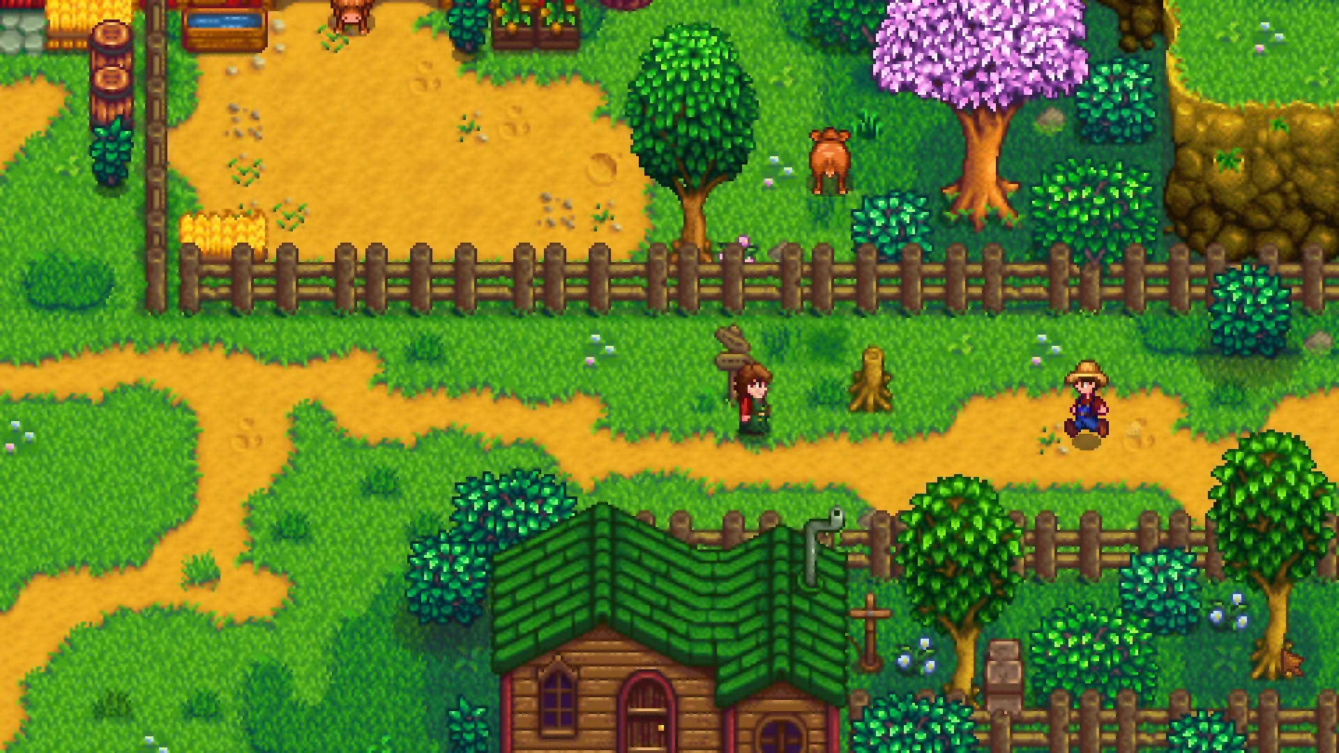 Screen z gry Stardew Valley, przedstawiający budynki i postacie w grze.